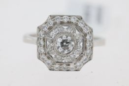 Platinum octagonal vintage inspired diamond ring. Centre rubover set old cut diamond 0.46ct. Rubover