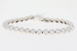 8ct Diamond Line Bracelet, 18ct white gold rub over set round brilliant cut diamond line bracelet.