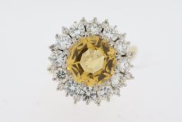 Imperial Topaz and diamond cluster ring. Faceted golden topaz surrounded by round brilliant cut
