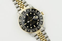 ROLEX OYSTER PERPETUAL DATE GMT-MASTER STEEL & GOLD REF. 16753 CIRCA 1987, circular black dial
