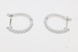 18ct white gold brilliant cut diamond claw set hoop earrings. Approximate total diamond weight 0.