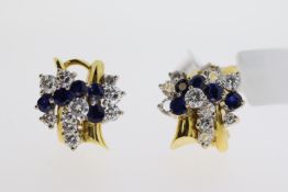 18ct yellow gold blue gem stone and diamond earrings. Round brilliant diamonds totaling approx 0.
