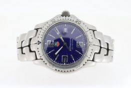 TAG HEUER PROFESSIONAL QUARTZ, circular blue dial with baton and arabic numeral hour markers,