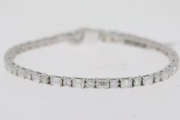 18ct white gold round brilliant and baguette cut diamond line bracelet. Total diamond weight
