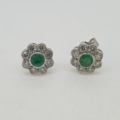 White gold circular daisy emerald and diamond earrings Emerald 0.80 cts Diamond 1ct 18ct