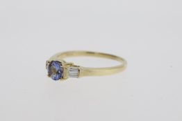 9ct Yellow Gold, 0.40pt Round Cut Tanzanite Centre, 0.16pt Tapered Baguette Side Stones (x1 broken),