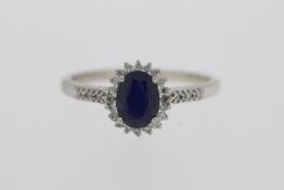 9ct White Gold, Oval Cut Sapphire Centre, 0.17pt Round Brilliant Cut Surround, Cluster Ring With
