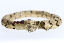 Period Yellow Metal Snake Bracelet, articulated tubular design, stone set eyes and head, believed to