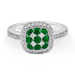 An 18ct White Gold Emerald And Diamond Cluster Ring