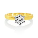 An 18ct Yellow And White Gold Diamond Solitaire Ring