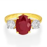 An 18ct Yellow And White Gold Ruby and Diamond Three-Stone Ring