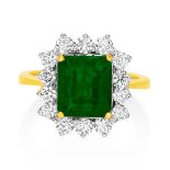 An 18ct Yellow And White Gold Emerald And Diamond Cluster Ring