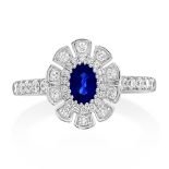 An 18ct White Gold Sapphire and Diamond Cluster Ring