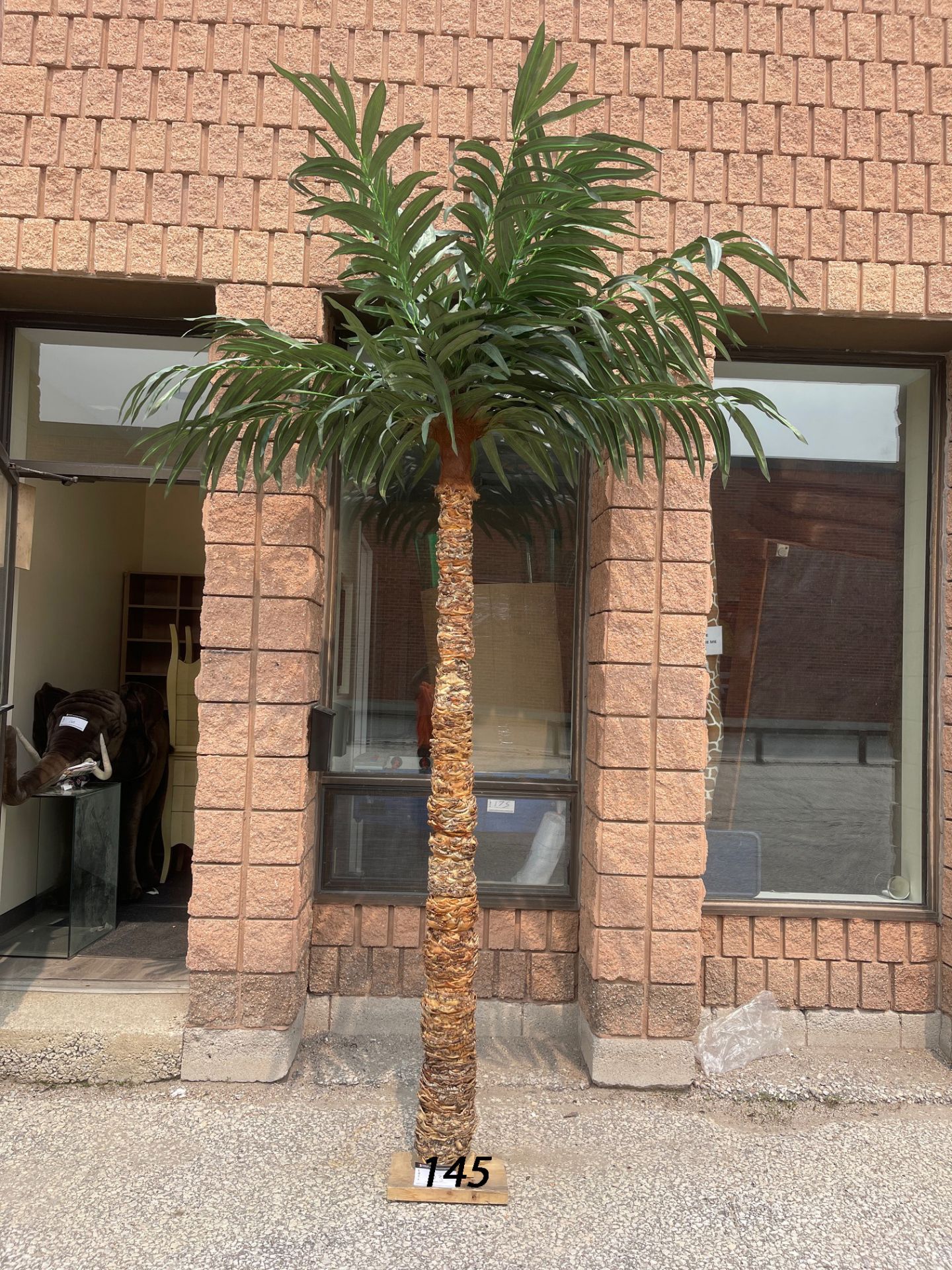 ARTIFICIAL PALM TREE, TREE BARK 84” HEIGHT WITH THE LEAVES 132” COMES WITH LARGE FLOWER POT - Image 6 of 7