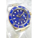 A Bi-Metal Rolex Submariner Watch, Stainless steel and 18ct yellow gold with a blue bezel and a blue