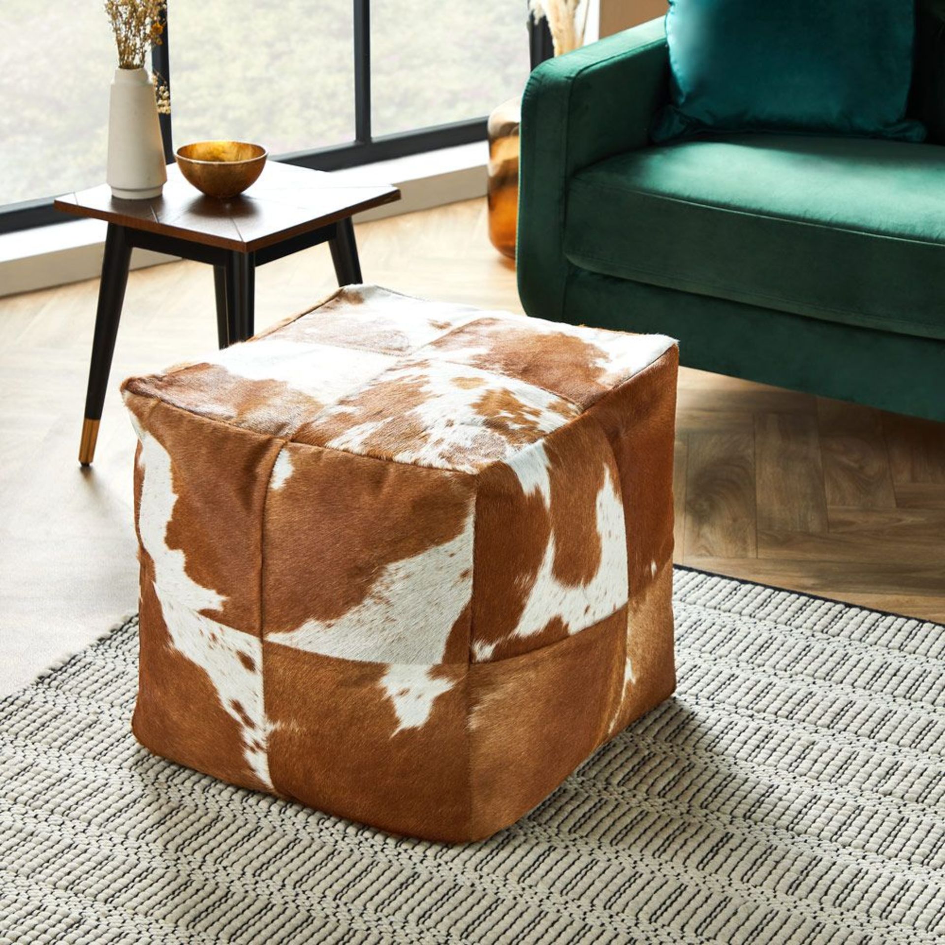Cowhide Cube Pouffe. Made with 100% leather for a durable finish, use as a footstool or small