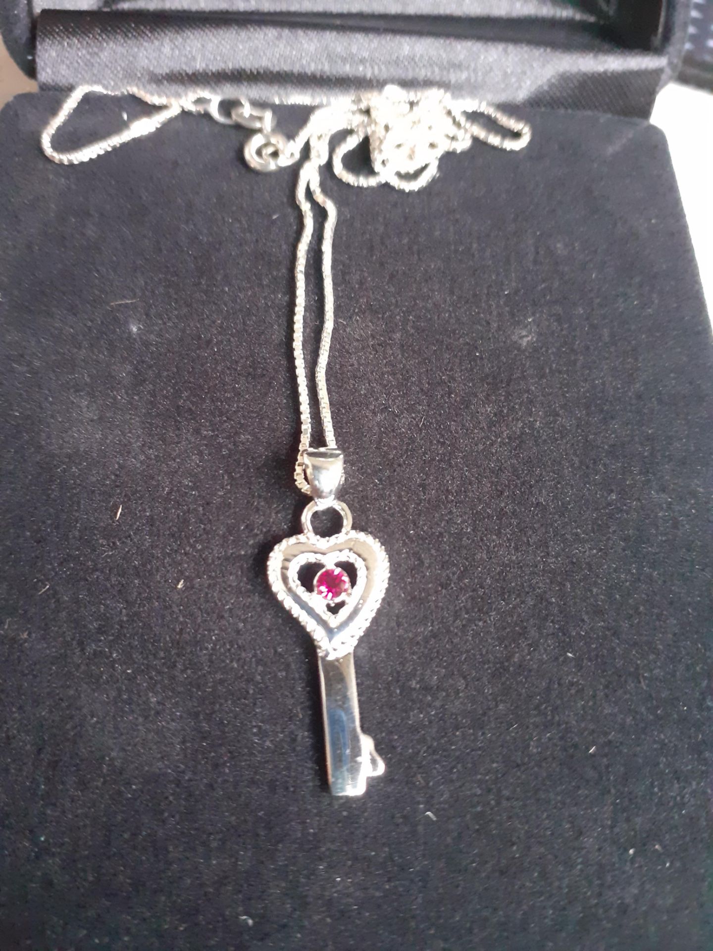 Brand new x5 silver key necklace with gem