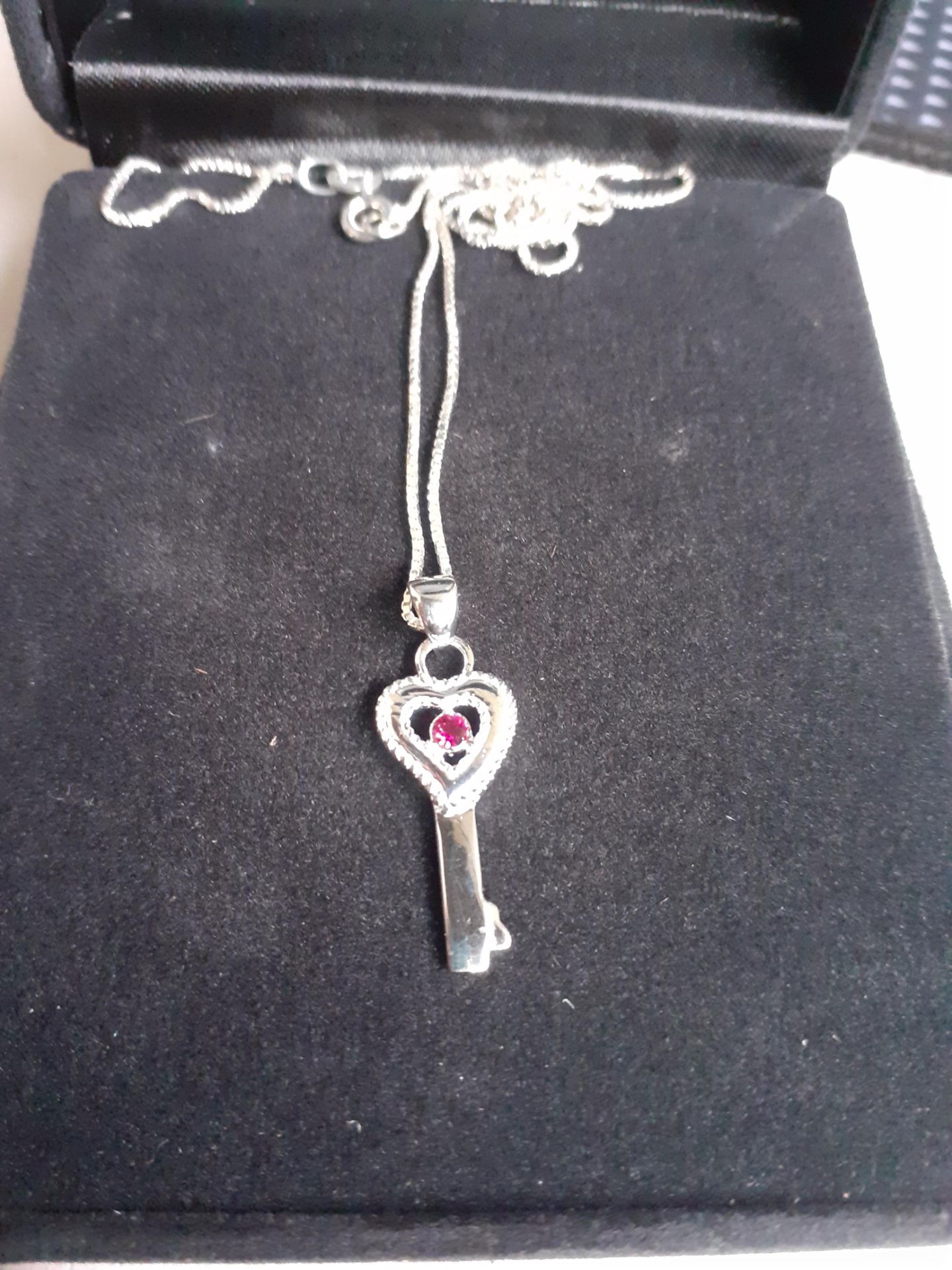 Brand new x5 silver key necklace with gem