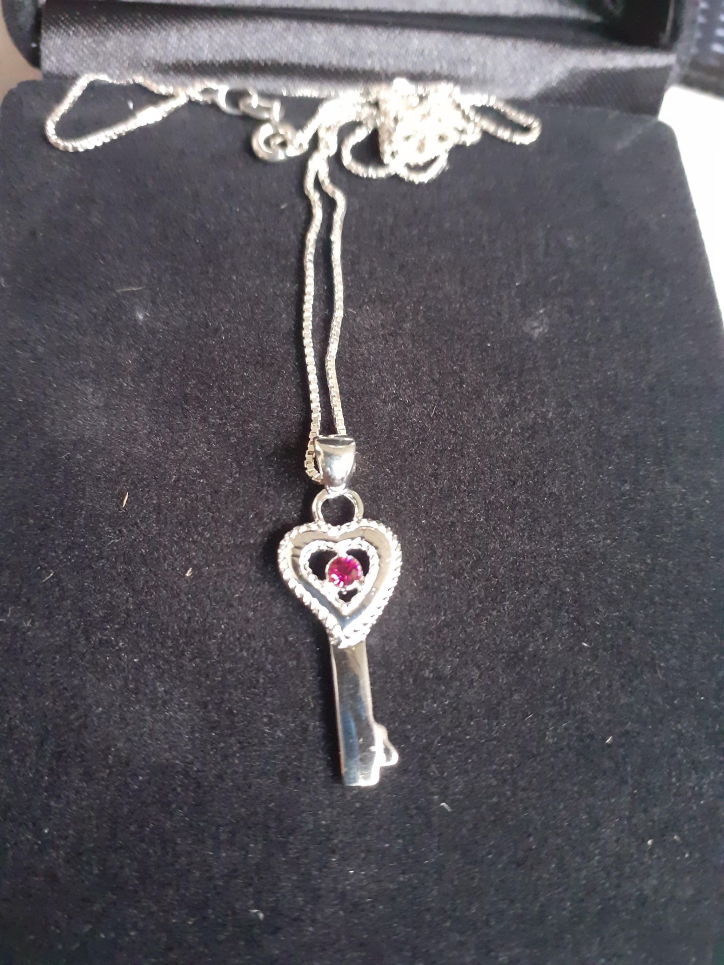 Brand new x5 silver key necklace with gem