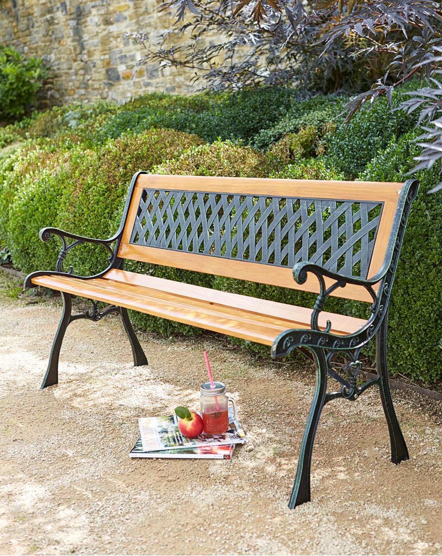 Lacy Bench. - SR4. This wooden bench has a strong iron frame with a lattice back. This traditional