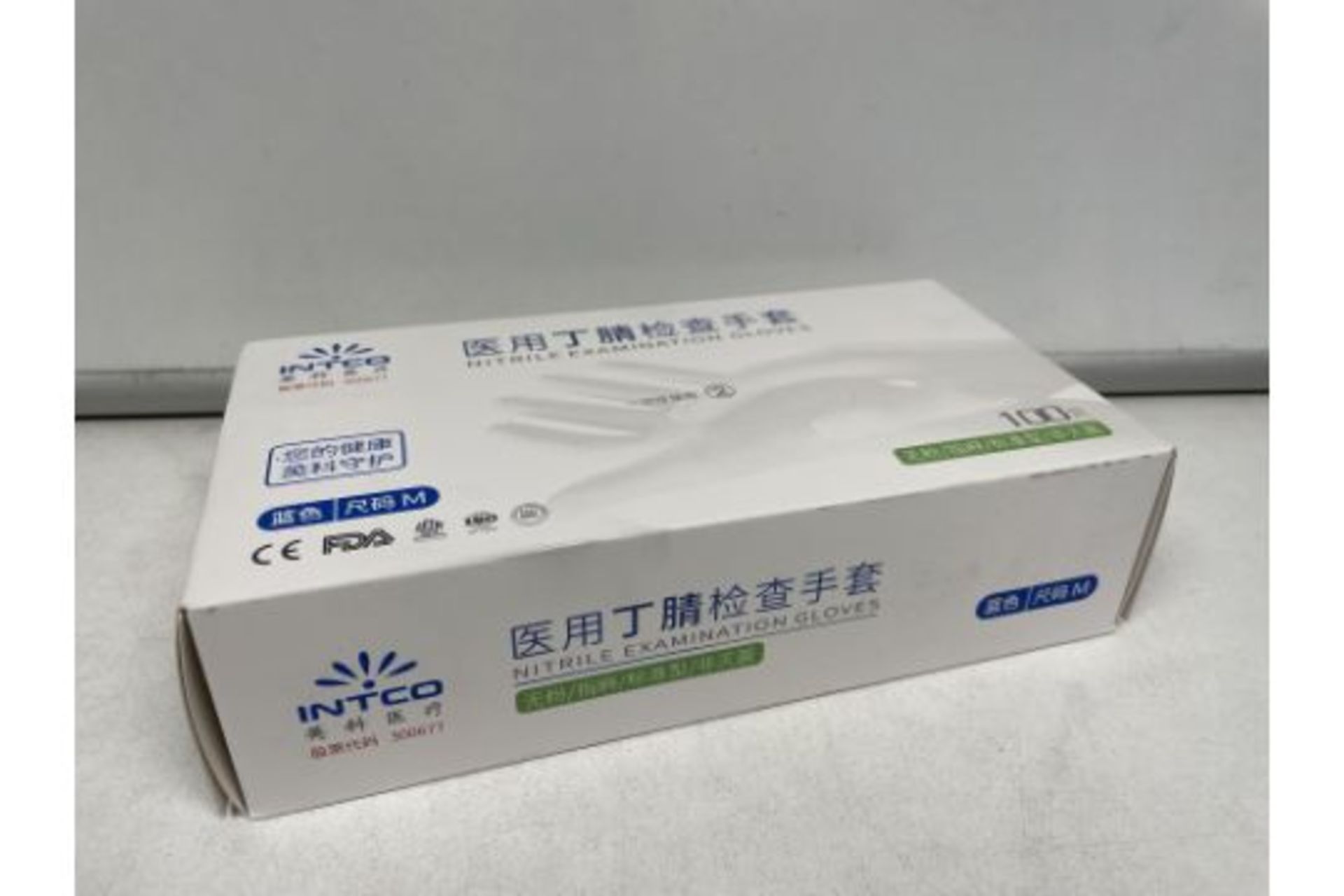 TRADE LOT 100 X NEW BOXES OF 100 INTCO NITRILE EXAMINATION GLOVES. SIZE MEDIUM. (ROW10.6) - Image 2 of 2