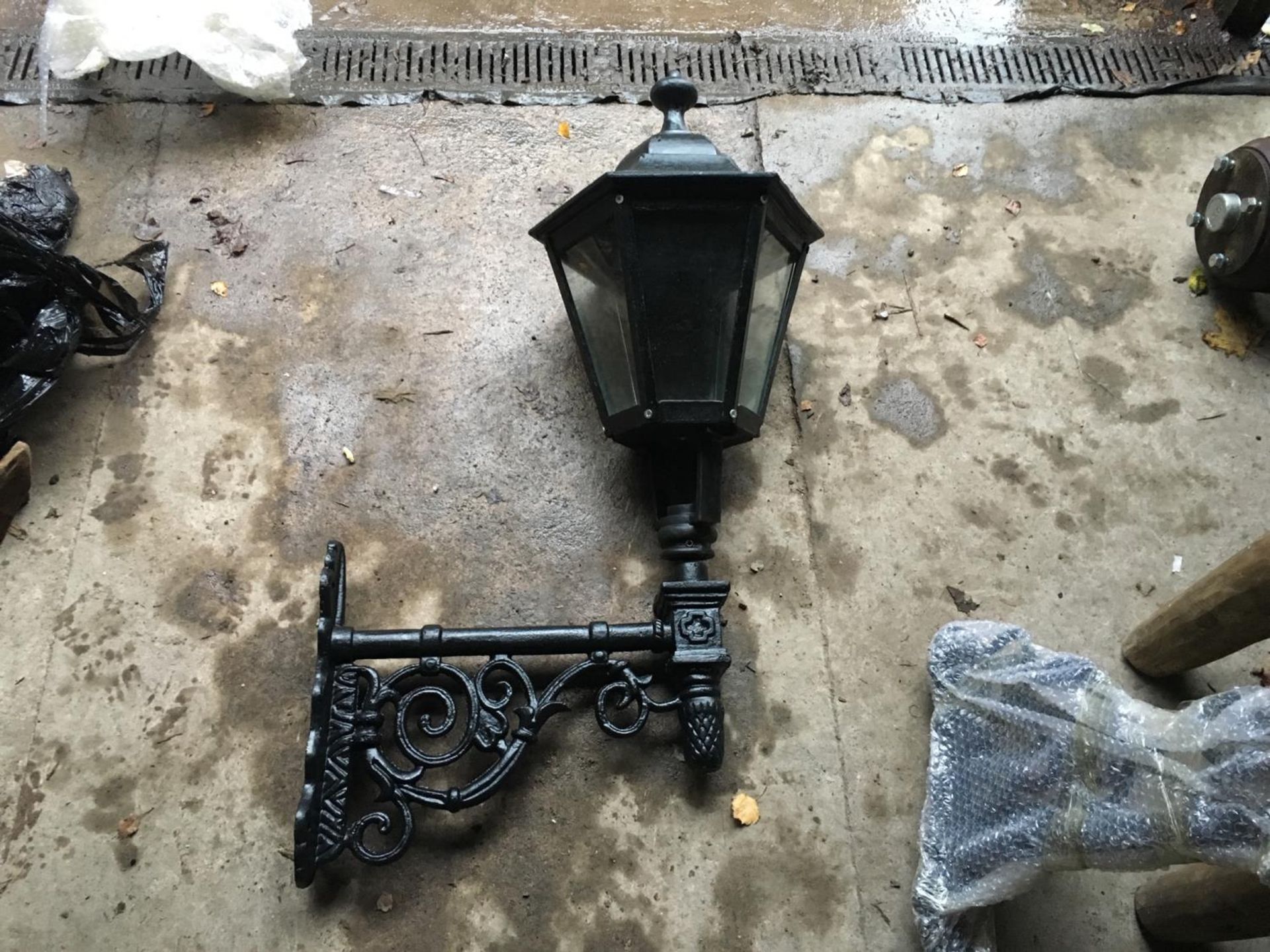 CAST IRON HUGE GLAZED LANTERN ON CAST IRON WALL BRACKET