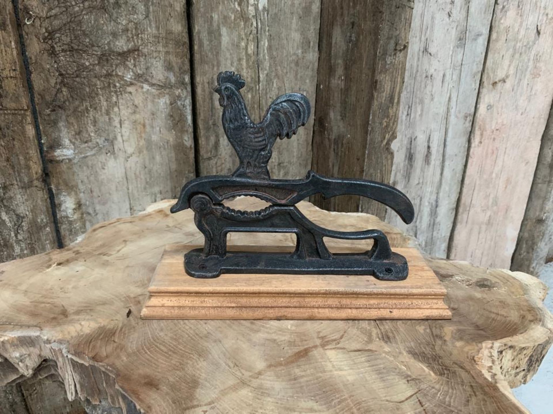 CAST IRON NUTCRACKER ON WOODEN BASE