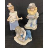 Selection of assorted Nao figures includes Boy playing accordian, girl playing with a musical