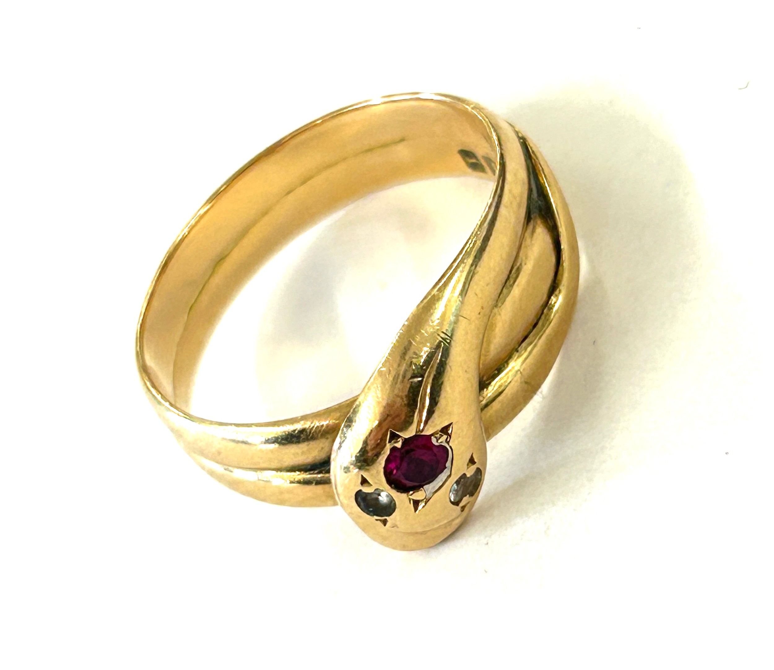 18ct gold snake ring set with diamond eyes and ruby head, hallmarks Sheffield 1926. Weighs approx