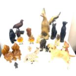 Large selection of dog figures includes Carved wooden, plastic, egyptian cats etc