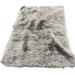 Large lounge rug measures approx 91 inches by 62inches