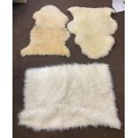 Selection of 3 vintage rugs includes 2 sheep skin measures approx 25 inches tall 29 inches wide