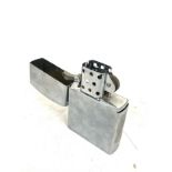 Large zippo style table lighter measures approx 7 inches high by 4.5 width