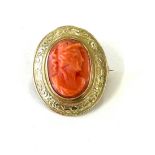 Antique coral brooch set in unmarked high carat gold mount