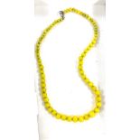 Set of Vintage yellow glass beads with silver clasp, length approx 22 inches long