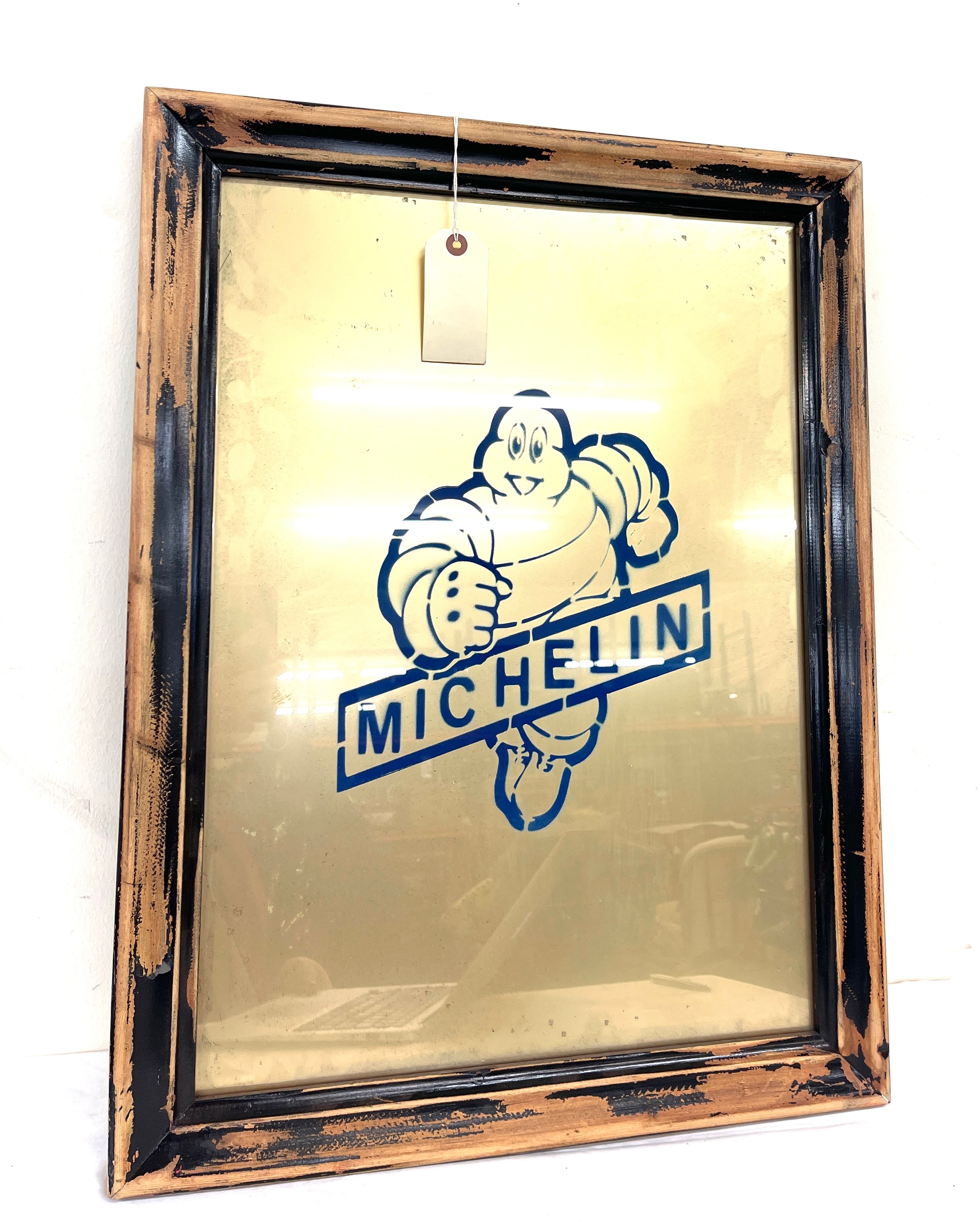 Framed glass advertising Michelin man, frame measures approx 25 inches by 19 inches