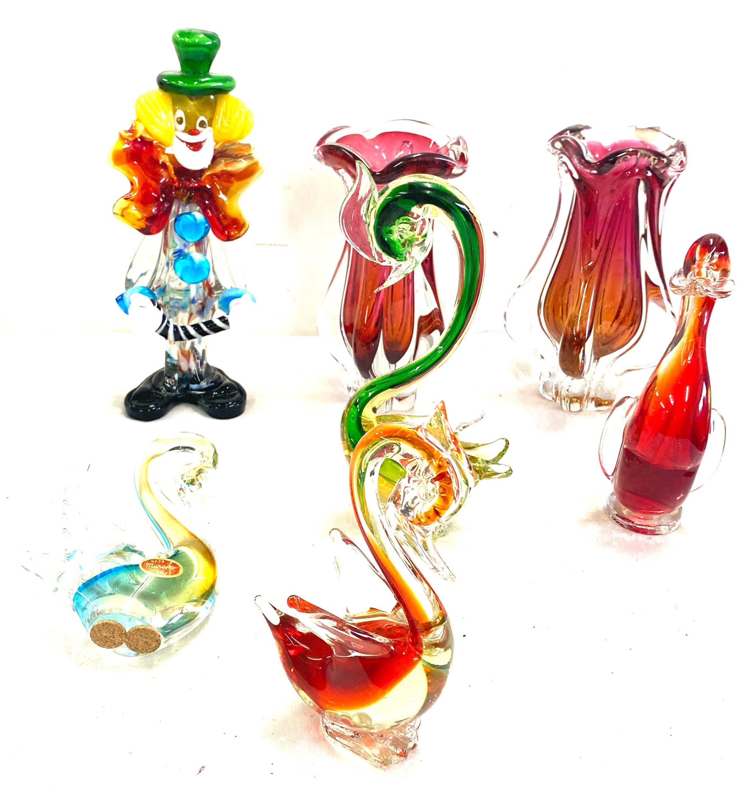 Selection of coloured Murano glass to include swan figures, a clown, vases etc, Some damage to