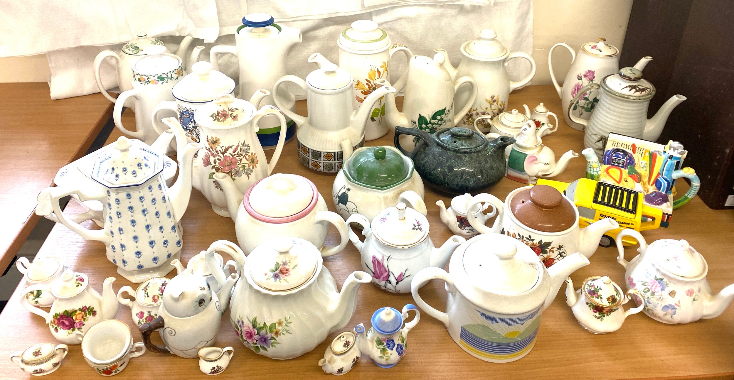 Large selection of assorted tea pots includes Sadler, Coalport, Novelty tea pots etc