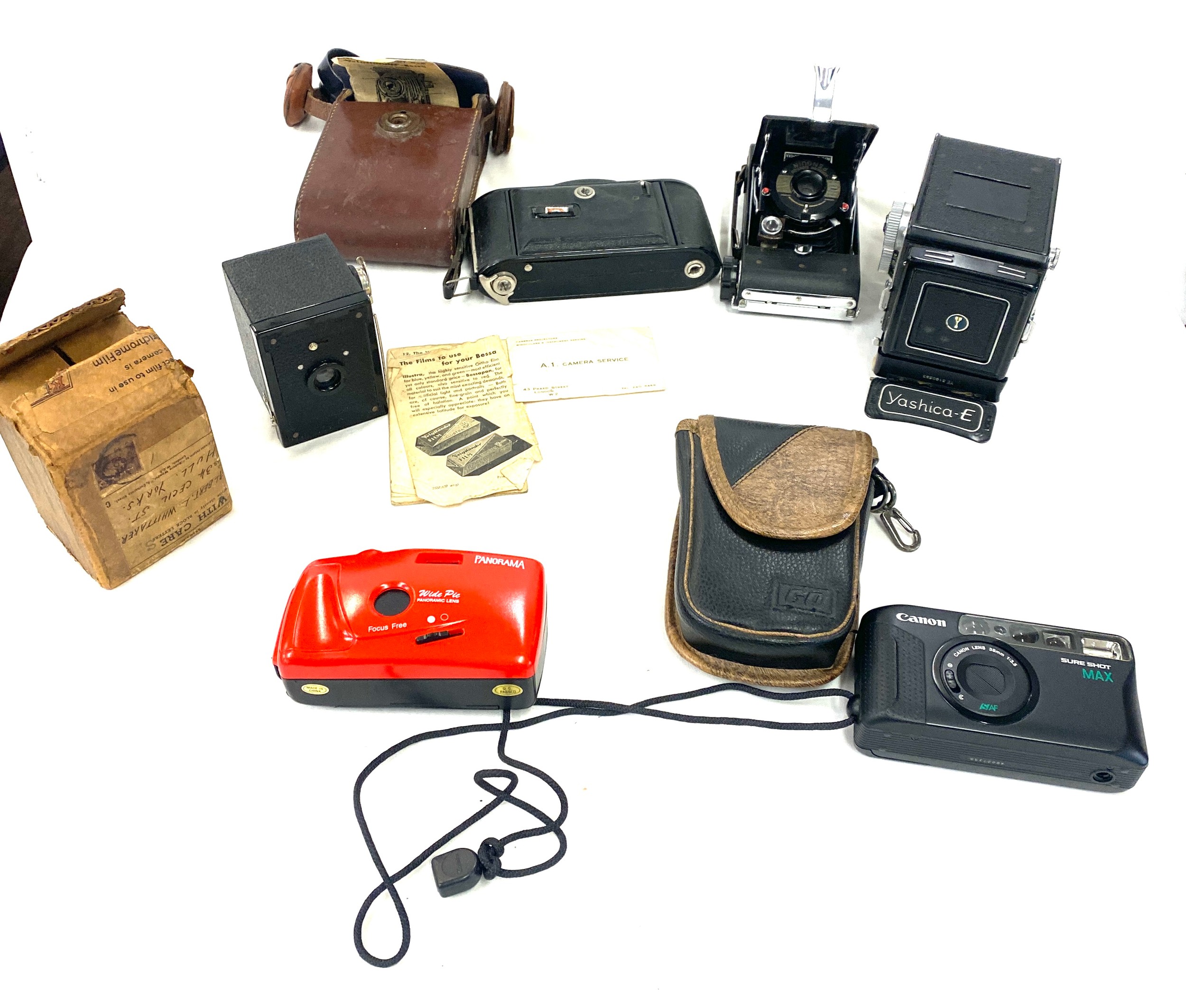 Selection of vintage cameras includes Yashica E, Penguin kershaw eight 20, yuighander bessa camera