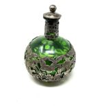 Antique silver covered green glass bottle measures approx height 14cm
