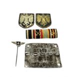 4 ww2 German badges etc inc p.o.w tag pith helmet badges & ribbon bar