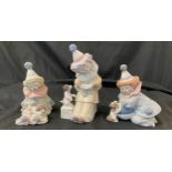 Selection of 3 Lladro figures includes Lladro clown figure seated with puppy dog 5277, clown with