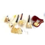 Small collection of antique Meerschaum pipes, one in original case