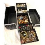 Selection of vintage and later costume jewellery in a case