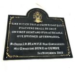 Cast iron sign, measures approx 9.5 inches tall 10 inches wide