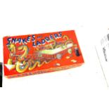 Vintage snakes and ladders and a selection of vintage marbles