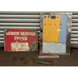 Selection of vintage tin signs and a metal machine door