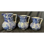 Three vintage blue and white graduating jugs largest measures approx 7.5 inches tall