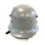 WW1 German Military helmet with shrapnel damage.