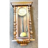 Mahogany Vienna vintage two key hole wall hanging clock with key and pendulum measures approx 33